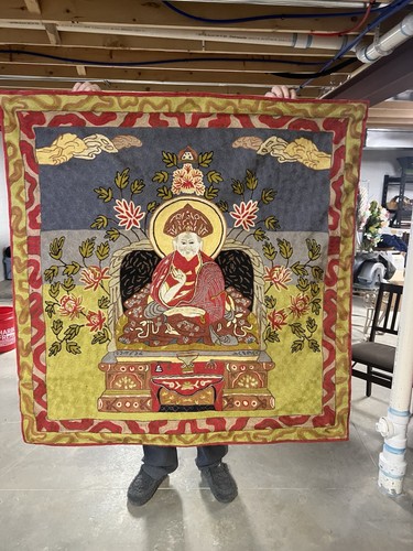 Silk embroidered Tibetan Buddhist thangka depicting a seated lama or Monk