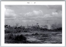 Vtg B&W Snapshot Landscape Field Cleared Earth Equipment Smoke Feb 1967