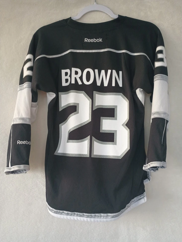 Camiseta de hóquei Reebok Los Angeles Kings Dustin Brown #23 NHL juvenil tamanho P/M - Imagem 4 de 4