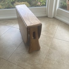 Modern Ercol extending coffee table .  Light colour .
