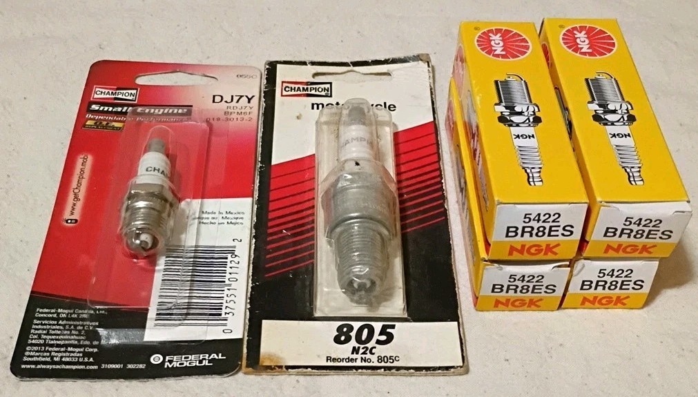 6 Assorted Spark Plugs 805, DJ7Y, 5422 A4
