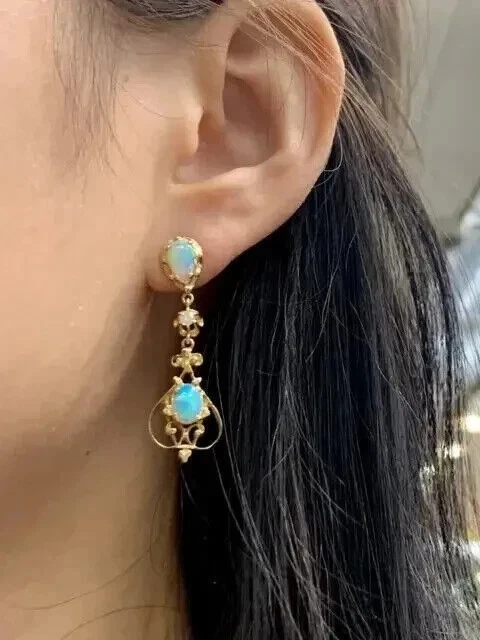 Pendientes colgantes colgantes de ópalo de fuego genuino talla pera de 2 quilates para mujer enchapados en oro amarillo de 14 quilates Foto 4 de 4