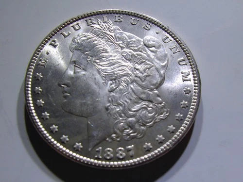 1887 Possible Slider to Uncirculated Morgan Dollar