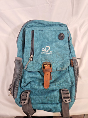 Waterfly Sling Bag Backpack Green and Black 6 Pockets Ultra Light Used Teal