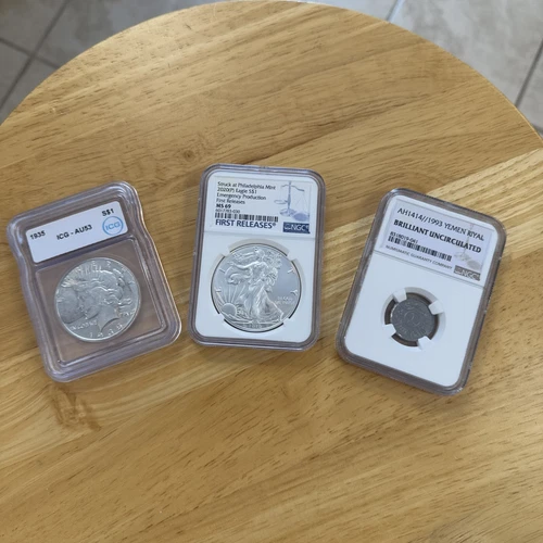 Silver Lot 1935 AU53 Peace Dollar NGC MS69 Silver Eagle 1993 Yemen NGC BU