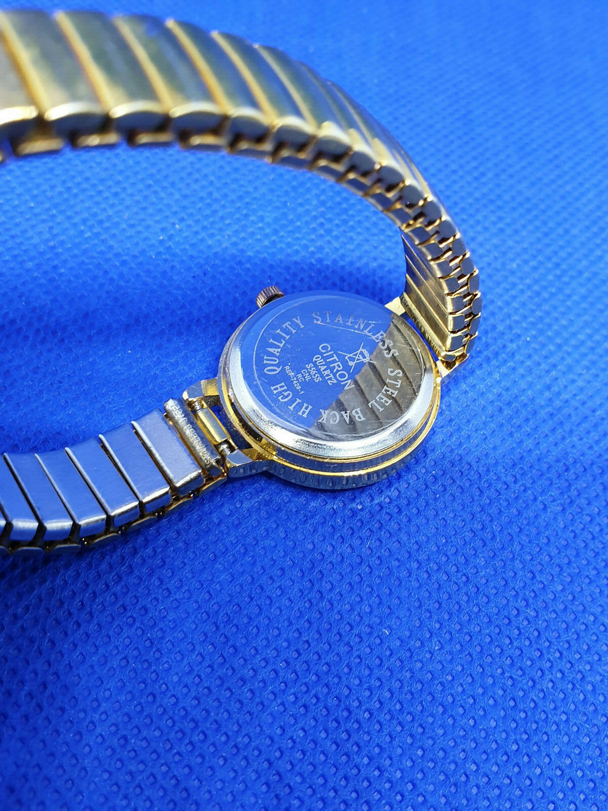 ladies citron gold tone watch,white face & black hands,expanding