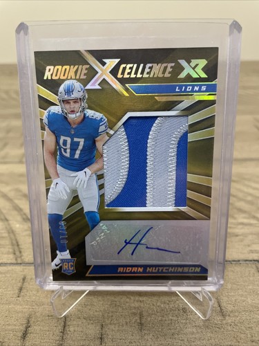 Aidan Hutchinson [Gold] #RXE-AH 2022 Panini XR Rookie Xcellence Autograph Swatches card