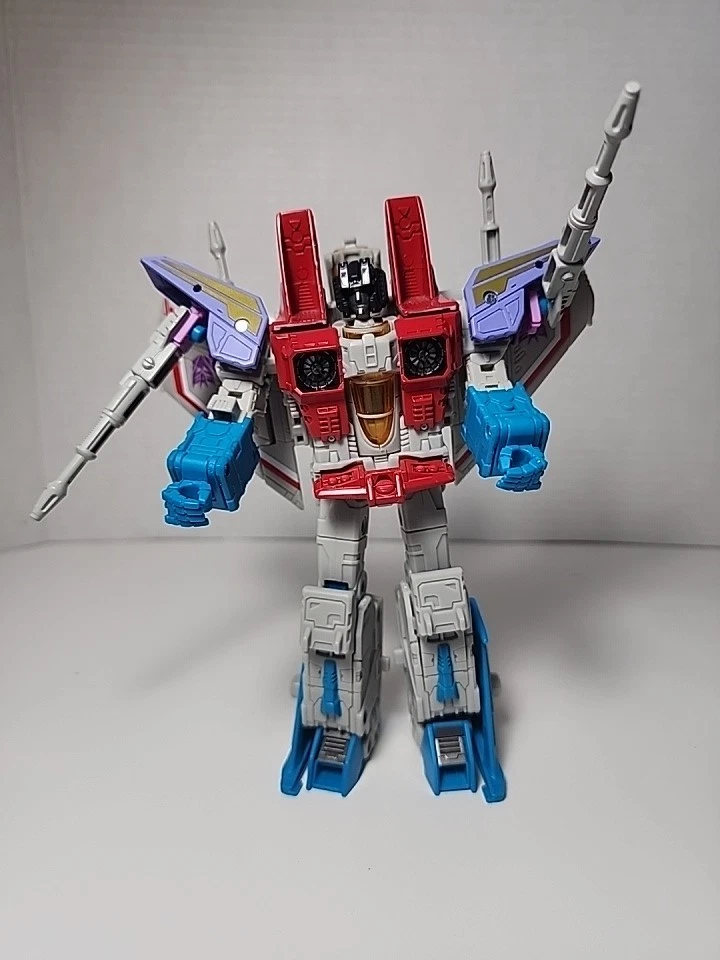 Lote de figuras de acción Transformers Starscream. Incluye pistola Kaiyodo Stars crema con Foto 3 de 4