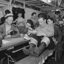 Royal Navy submariners reading letters from home board Royal Navy - 1930s Photo