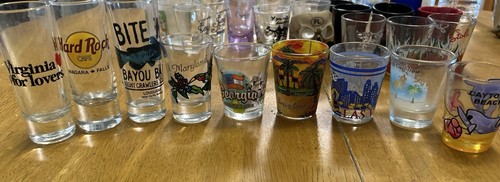 Nine shot glasses from different states