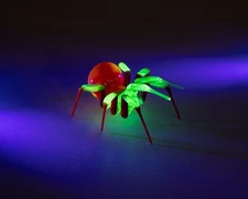 Red Glowing Glass Spider Figurine – Handmade Uranium Glass Art, UV Reactive