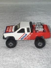 Vintage Hot Wheels 1986 Trailbusters - Nissan Hardbody 4x4 Pickup Truck