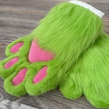 The animal's fluffy green paws were made by hand. SALE