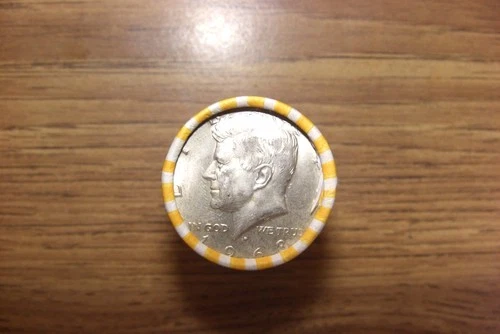 kennedy half dollar roll with a 40% silver 1968 half on end in vV- good cond.