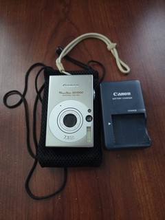 PREOWNED CANON POWERSHOT SD1000 DIGITAL ELPH CAMERA 17.1MP CHARGER & SD ADAPTER