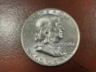 1958 D Franklin Silver Dollar - AU Condition with a few scratches
