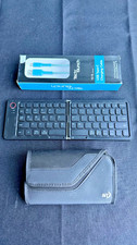Mini foldable Bluetooth keyboard designed for travel with cord