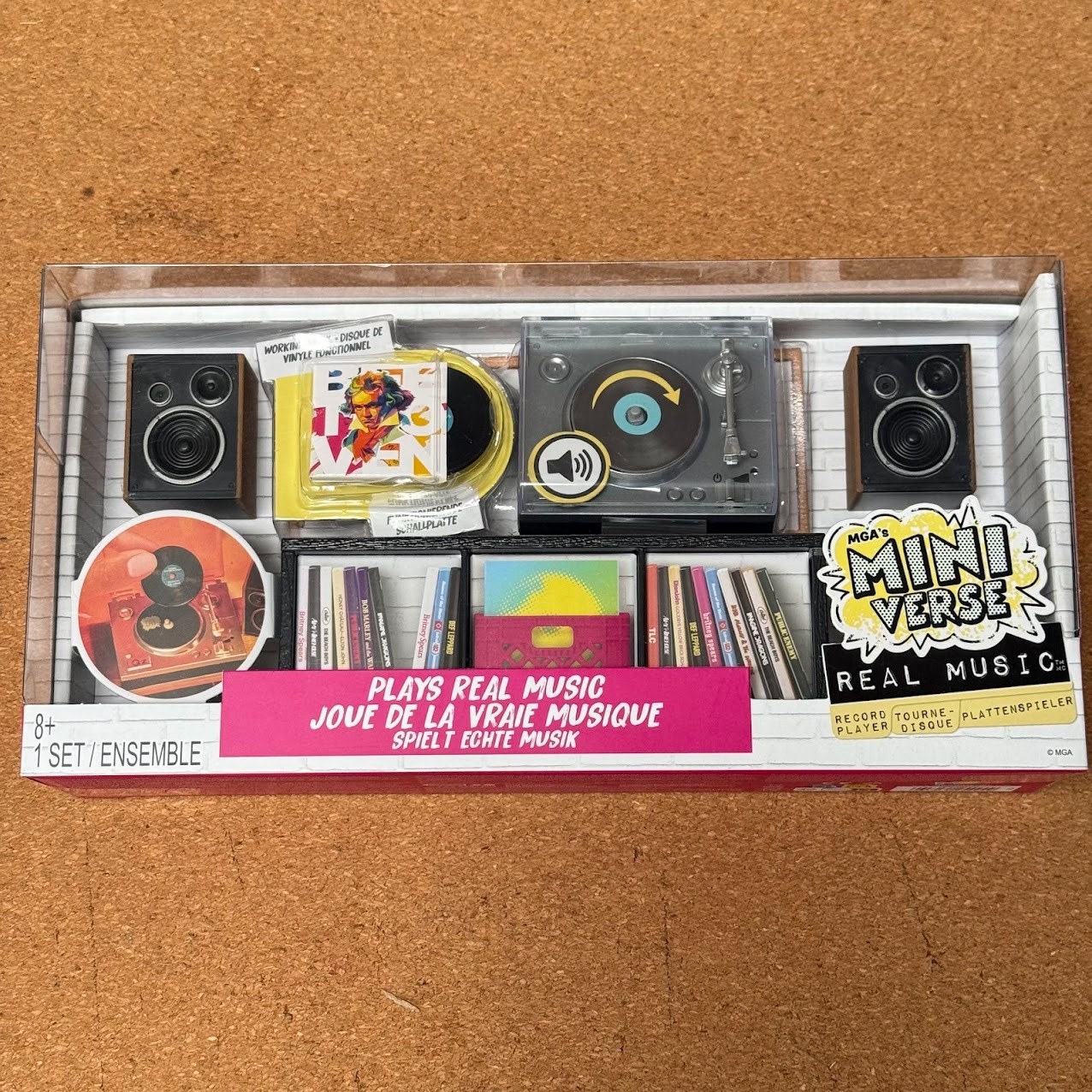 MGA's Miniverse Real Vinyl Music Record Player in hand