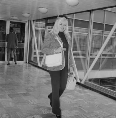English actress and singer Diana Dors at Heathrow Airport, London, - Old Photo