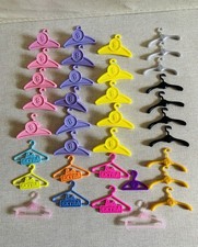 A Bundle Of Used Barbie Doll Clothes Hangers Different Types In Good Condition