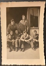 Military Snapshot Photo  Six WW II era Soldiers Sit Together Outside Barracks