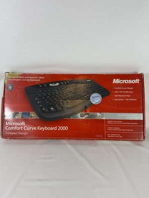 SEALED Microsoft Comfort Curve Keyboard 2000 Wired USB Ergonomic Compact Design