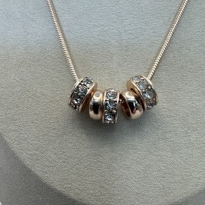Guess Gold Tone 5 Ring Pendant Necklace