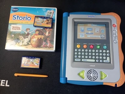 Console Storio VTech + 2 jeuw - WINNIE L'OURSON & Rufus un petit chien en ville - Photo 1/4