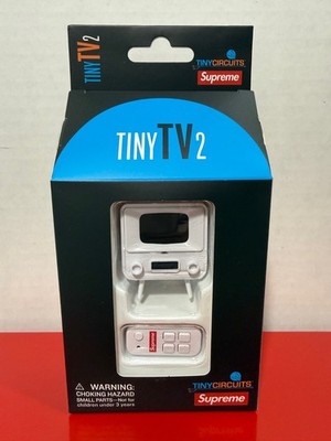 Supreme Tiny TV 2 Mini Television With Remote In Hand Ready To