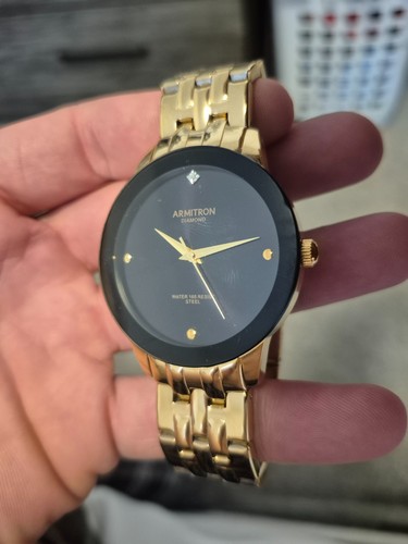 Gold Armitron mens watch with diamond