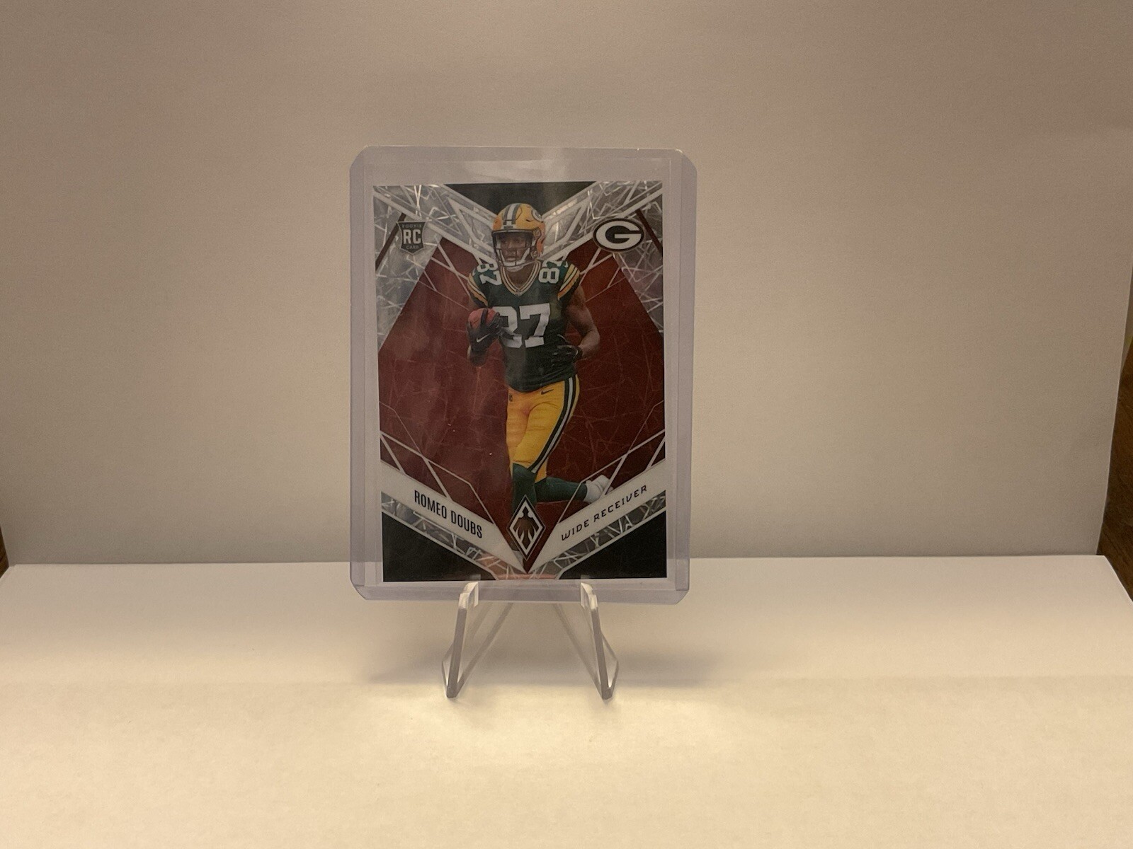 2022 Panini Phoenix - Rookies Red Lazer #135 Romeo Doubs /150 (RC)