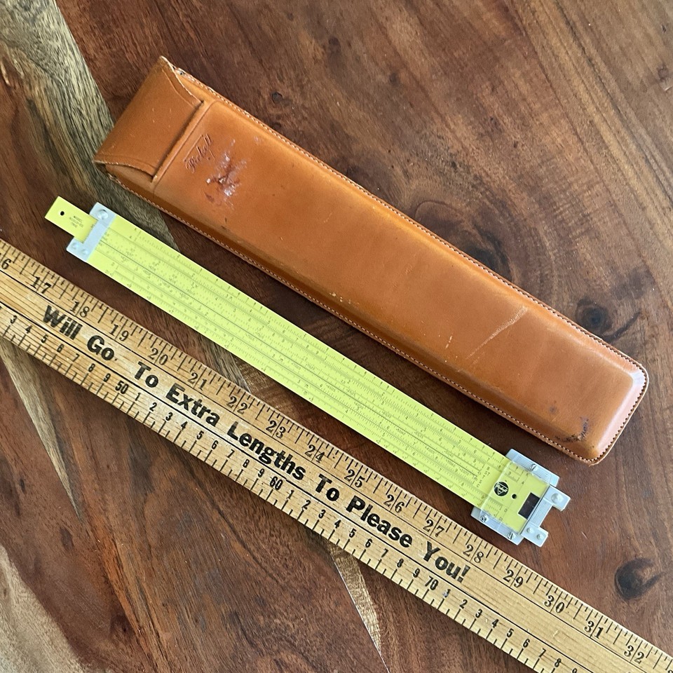 A classic Pickett N1010-ES trig slide rule with leather case — a handsome, ready-to-display piece of pre-digital STEM history.
