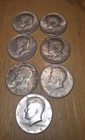 Lot of  (7) 1964 Kennedy Silver Half Dollars