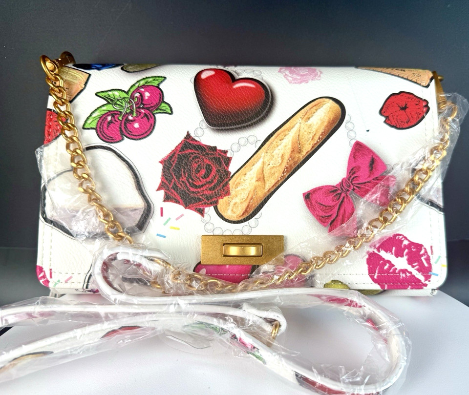 A Betsey Johnson sample-run novelty crossbody covered in foodie hearts — rare, quirky, and exactly the kind of conversation-starting bag that makes a perfect wild-card gift.