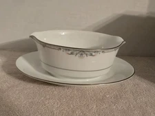 Noritake "Enhancement" pattern gravy boat with an attached underplate.