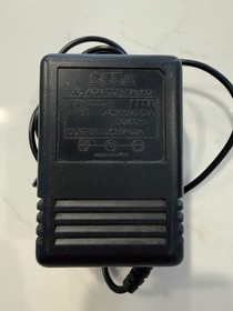 SEGA GAME GEAR BLACK HANDHELD SYSTEM WITH 12 GAMES CHARGER, COVER, TURNS ON