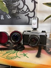 Pentax K1000 35mm film camera with 50mm f2.8 lens and 135mm f3.5 lens