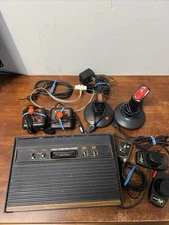 Atari Lot -Consoles, Various Controllers, Cords, Adapters NOT TESTED- SOLD AS IS