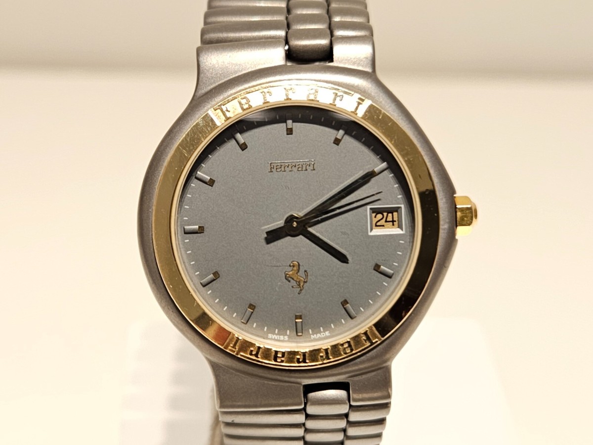 VINTAGE SWISS TITANIUM AND GOLD ADVERTISING OF CAR 
