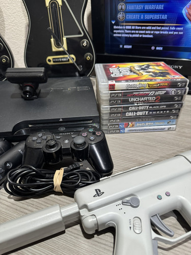 Playstation 3 Konsole inklusive 27 Spielen und 2 Guitar Hero Gitarren. Alles lesen - Bild 4 von 8