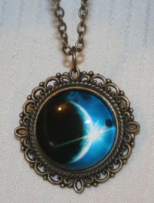 Delightful Picot Rimmed Brasstone Blue Black Eclipse of the Sun Pendant Necklace