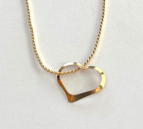 14kt Gold Heart pendant necklace .1 grams - 15.5" Trifari gold tone chain