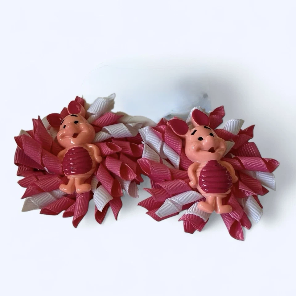 Lote de 2 pares de clips de cocodrilo con moño para niños pequeños de Winnie The Poo - Foto 3 de 4