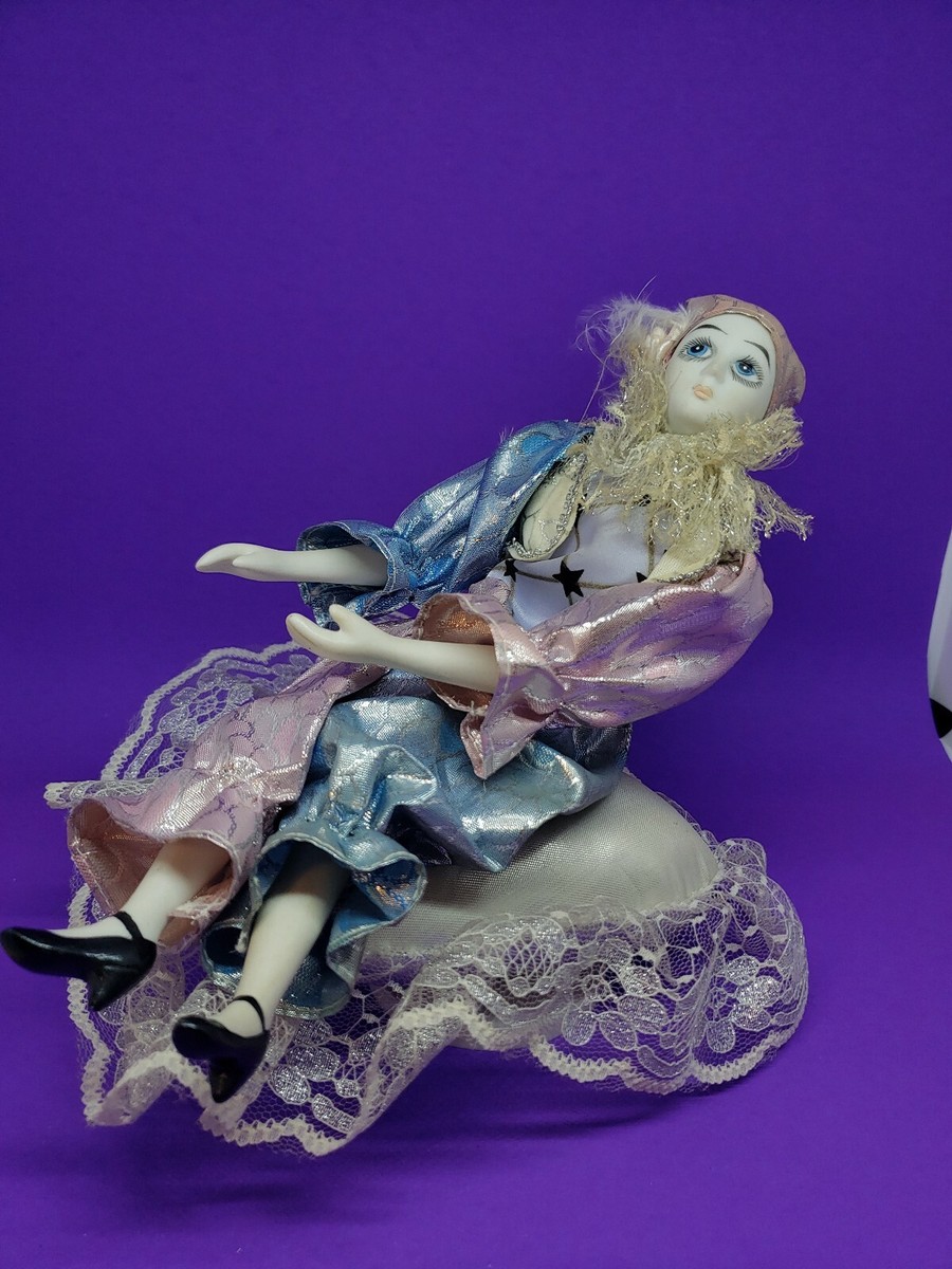 Musical Clown Jester Porcelain Bisque Sitting on Heart Satin