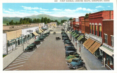 VTG 1934 * PC FIRST AVENUE LOOKING SOUTH SANDPOINT ID BIZ SIGNS TEICH NOS MINT *