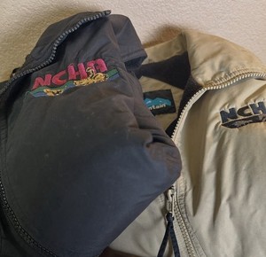 2 Tri-Mountain Med Size Vests. Tan & Black. National Cutting Horse Assoc. Logo