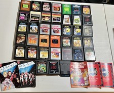 Lote probado de 38 juegos Atari 2600 algunos manuales catálogos ET Frogger Spiderman DC
