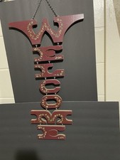 Rare wooden "WELCOME" hanging sign, likely hand-painted with a floral motif