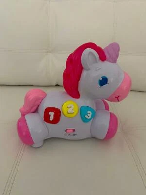 bright starts rock and glow unicorn toy