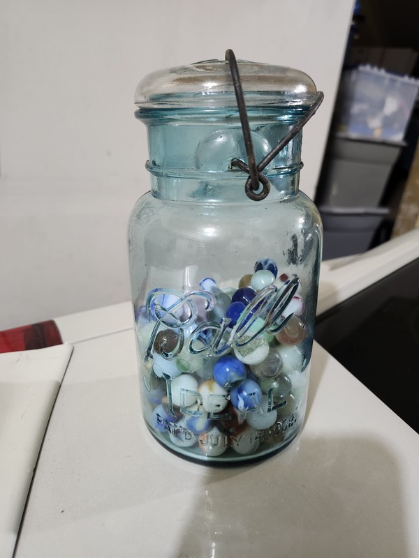 1908 ball ideal blue tint jar with vintage marbles 